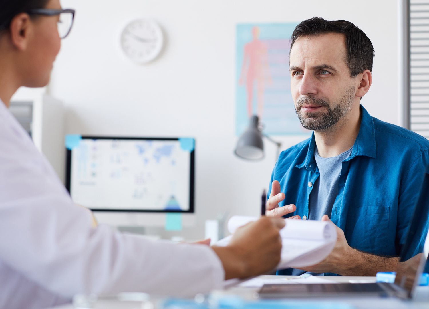 Man discussing Lutetium PSMA therapy options with his doctor during a consultation